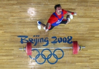 BEIJING - AUGUST 18: Dmitriv Klokov of Russia celebrates a lift en route to winning the silver medal in the Men's 100KG Weightlifting Competition during Day 10 of the Beijing 2008 Olympic Games on August 18, 2008 in Beijing, China. (Photo by Donald Miralle)